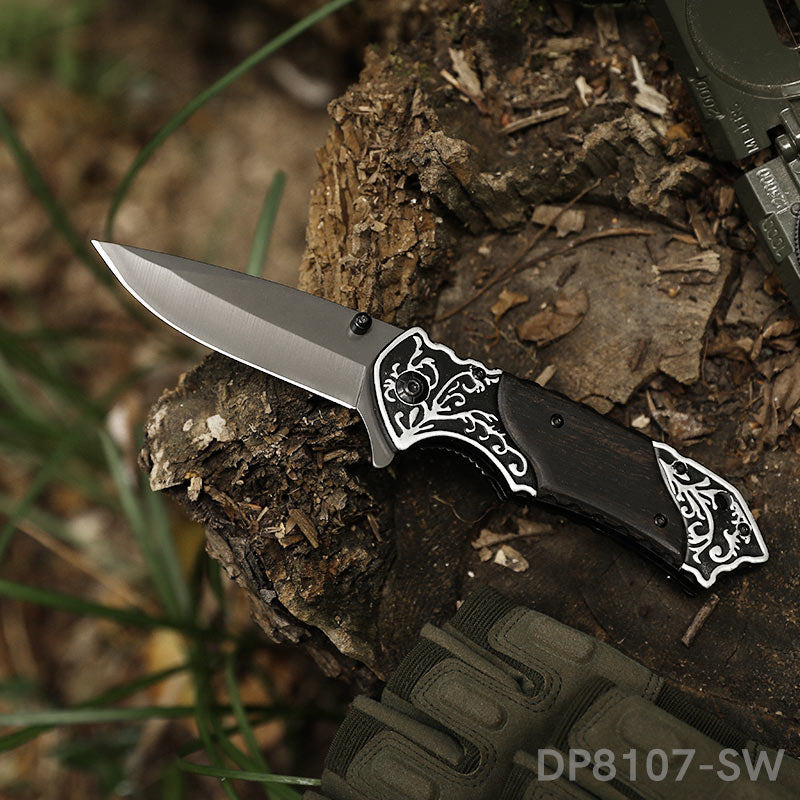 https://www.dispatchknives.com/cdn/shop/products/Folding-Pocket-Knife-with-Embossed-Handle-for-Outdoor-Camping-1.jpg?v=1658385306